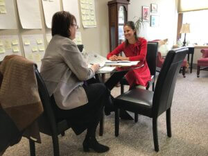 Executive Director Jamie Schloegel works with a donor