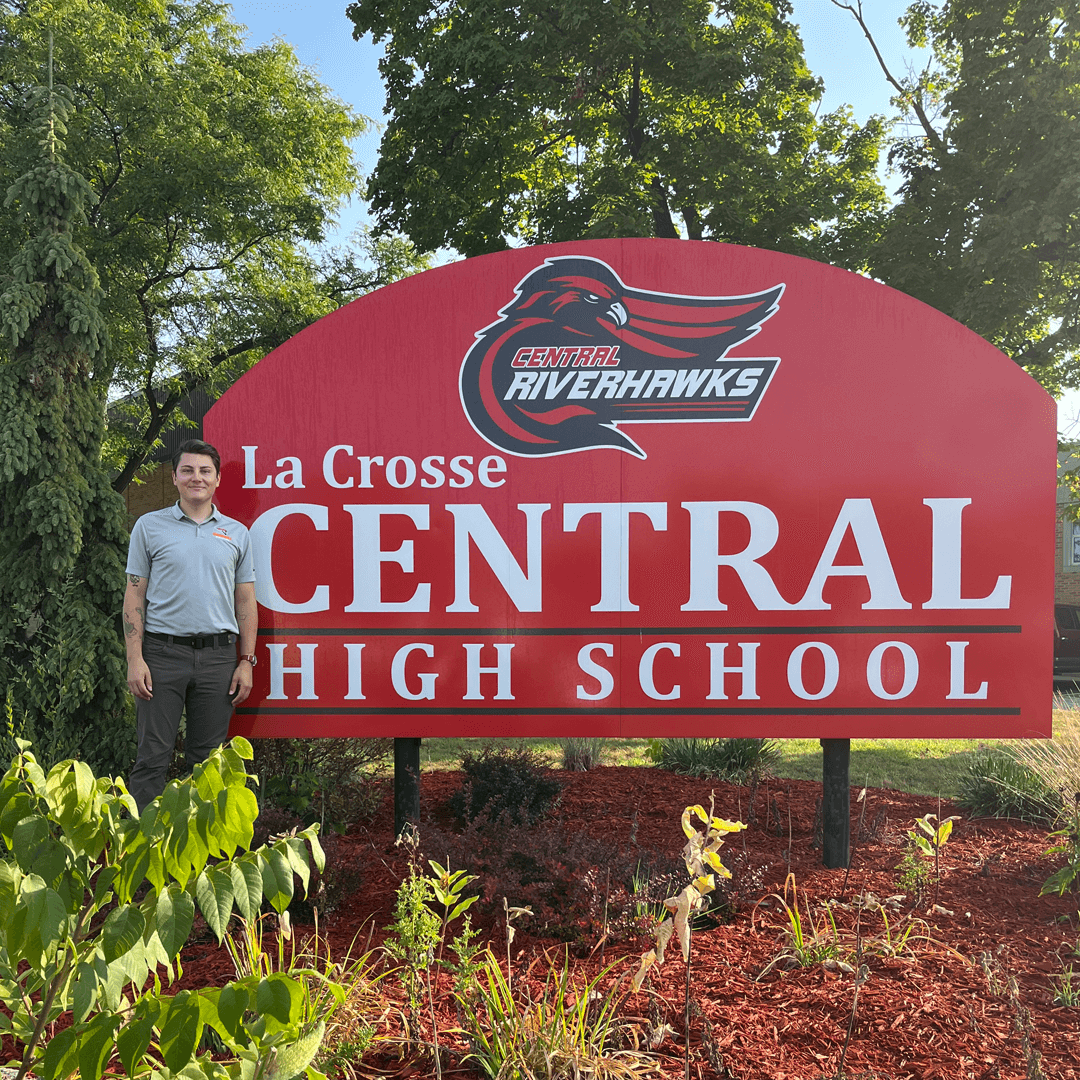 Nicholas Padesky stands next to Central High School sign