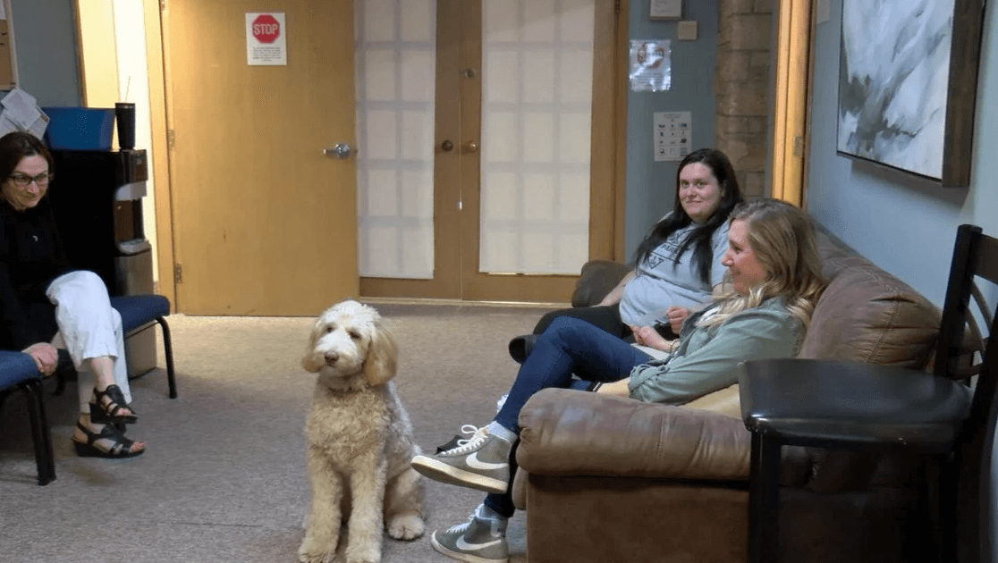 Therapy dog Ozzie visits residents at Adult & Teen Challenge.