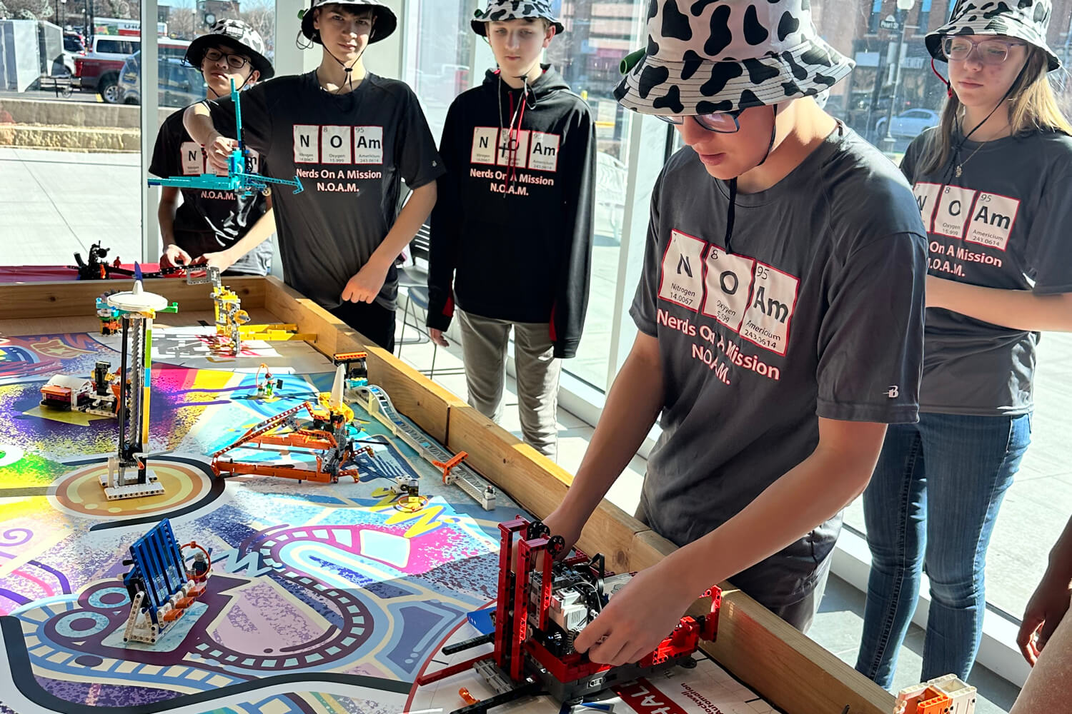 Holmen's FIRST Lego League team, Nerds On A Mission, demonstrates what their robot can do at the Seven Rivers Regional Robotics Competition.